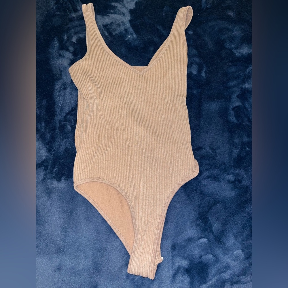 Woman’s Tan Ribbed Body Suit